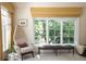 Comfortable living area featuring a chair, bench and a large window providing plenty of natural light at 4508 Lowell Blvd, Denver, CO 80211