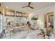 Bright living room boasts large windows, neutral decor, and hardwood floors at 4508 Lowell Blvd, Denver, CO 80211