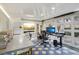 Contemporary office featuring a large work table, TV, and stylish hexagonal flooring at 4508 Lowell Blvd, Denver, CO 80211