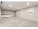Finished basement with carpet, recessed lighting, and a built-in counter with cabinets at 3 Glenview Dr, Littleton, CO 80123