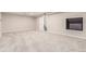 Spacious basement area with neutral carpet and walls, offering versatile living or storage space at 3 Glenview Dr, Littleton, CO 80123