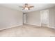 Bedroom featuring carpet, ceiling fan, white trim and neutral walls at 3 Glenview Dr, Littleton, CO 80123