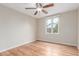 Comfortable bedroom with natural light, a ceiling fan and attractive hardwood floors at 3 Glenview Dr, Littleton, CO 80123