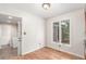 Cozy breakfast nook featuring hardwood floors, a large window, and access to the laundry room at 3 Glenview Dr, Littleton, CO 80123