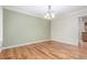 Elegant dining room featuring hardwood floors, decorative chandelier and large open space at 3 Glenview Dr, Littleton, CO 80123