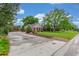 A wide concrete driveway provides ample parking at 3 Glenview Dr, Littleton, CO 80123