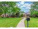 Charming brick home with a lush green lawn and inviting walkway at 3 Glenview Dr, Littleton, CO 80123