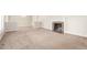 Spacious living room featuring a cozy fireplace and plush carpeting at 3 Glenview Dr, Littleton, CO 80123