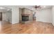 Hardwood floors and a brick fireplace are featured in this cozy living room at 3 Glenview Dr, Littleton, CO 80123