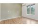 Stylish room featuring sleek wood floors and a large window that fills the space with natural light at 3 Glenview Dr, Littleton, CO 80123