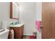 Bathroom featuring a vanity with storage, mirror, and a clean, functional layout at 19335 E Batavia Pl, Aurora, CO 80011