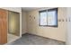 Neutral bedroom with ample space, carpet flooring, and natural light from the window at 19335 E Batavia Pl, Aurora, CO 80011