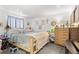 Comfortable bedroom featuring a wooden bed frame and dresser with drawers at 19335 E Batavia Pl, Aurora, CO 80011