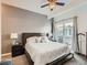 Bright bedroom with a king-size bed, access to a balcony, and ceiling fan at 1537 W 43Rd Ave, Denver, CO 80211