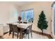 Cozy dining area with wooden table and four chairs at 1537 W 43Rd Ave, Denver, CO 80211