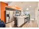 Modern kitchen with stainless steel appliances and island at 1537 W 43Rd Ave, Denver, CO 80211