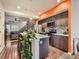 Contemporary kitchen with an island and orange accent wall at 1537 W 43Rd Ave, Denver, CO 80211