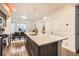 Modern kitchen with large island and breakfast bar at 1537 W 43Rd Ave, Denver, CO 80211