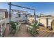 Relaxing rooftop deck with pergola, seating, and city views at 1537 W 43Rd Ave, Denver, CO 80211