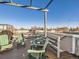 Relaxing rooftop deck with pergola, chairs, and city views at 1537 W 43Rd Ave, Denver, CO 80211