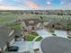 Beautiful neighborhood aerial view of a home with a three car garage and well maintained landscaping at 23696 E Del Norte Pl, Aurora, CO 80016