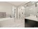Stunning bathroom features dual vanities, a soaking tub, mosaic tile accents, and a glass-enclosed shower at 23696 E Del Norte Pl, Aurora, CO 80016