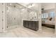 Stylish bathroom with black cabinetry, walk-in shower with mosaic tile, and a large mirror to provide bright light at 23696 E Del Norte Pl, Aurora, CO 80016