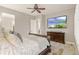 Relaxing bedroom with a ceiling fan, TV, plush pillows and lots of natural light streaming in from the windows at 23696 E Del Norte Pl, Aurora, CO 80016