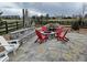 Backyard with a fire pit, a waterfall feature, and beautiful patio with stylish seating all around at 23696 E Del Norte Pl, Aurora, CO 80016