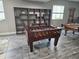 Basement rec room featuring a foosball table and billiards table, perfect for entertaining guests at 23696 E Del Norte Pl, Aurora, CO 80016