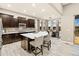 Open concept kitchen with a large center island, seating, and stainless steel appliances at 23696 E Del Norte Pl, Aurora, CO 80016
