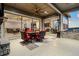 Outdoor patio featuring a fireplace, seating, and views of an open concept living area at 23696 E Del Norte Pl, Aurora, CO 80016