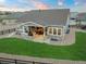 Charming home featuring a covered patio with an outdoor kitchen and fireplace, perfect for entertaining at 23696 E Del Norte Pl, Aurora, CO 80016