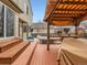 Backyard featuring a covered patio, hot tub, and seating at 11395 E 116Th Dr, Commerce City, CO 80640