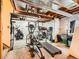 Basement gym featuring a treadmill, weights, and various exercise equipment at 11395 E 116Th Dr, Commerce City, CO 80640