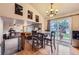Open dining area flows to living space and features sliding glass doors to a backyard deck at 11395 E 116Th Dr, Commerce City, CO 80640