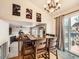 This dining room features hardwood floors, modern art, and a chandelier at 11395 E 116Th Dr, Commerce City, CO 80640