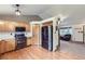 Modern kitchen features stainless steel appliances and leads into a cozy living area with great natural light at 11395 E 116Th Dr, Commerce City, CO 80640