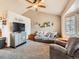 Bright and comfortable living room featuring vaulted ceiling, and neutral decor at 11395 E 116Th Dr, Commerce City, CO 80640