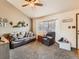Cozy living room with plush seating, lots of light and views of the front yard at 11395 E 116Th Dr, Commerce City, CO 80640