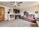 Comfortable living room with a fireplace and large-screen TV is perfect for relaxing and entertaining at 11395 E 116Th Dr, Commerce City, CO 80640