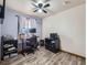 Office with a desk, computer, printer, and chair at 11395 E 116Th Dr, Commerce City, CO 80640