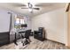 Home office with an adjustable desk, dual monitors, and modern black furnishings at 11395 E 116Th Dr, Commerce City, CO 80640