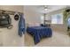 Bedroom featuring a bed, desk, and decorations such as a hat, jacket, and bookbag hung up at 3810 Cadence Dr, Castle Rock, CO 80109