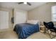 Bedroom with ceiling fan, closet, and a study area with an ergonomic chair at 3810 Cadence Dr, Castle Rock, CO 80109