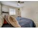 Bedroom featuring neutral walls, carpet floors, window, and decor with a ceiling fan at 3810 Cadence Dr, Castle Rock, CO 80109