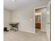 Bedroom showcasing neutral walls and carpet, leading to an ensuite bathroom for convenience and privacy at 3810 Cadence Dr, Castle Rock, CO 80109