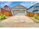 A well-maintained two-car garage with a concrete driveway at 3810 Cadence Dr, Castle Rock, CO 80109