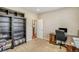 Neutral home office featuring built in shelving and a view to an adjacent room at 3810 Cadence Dr, Castle Rock, CO 80109
