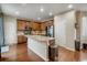 Well-appointed kitchen featuring granite countertops, stainless steel appliances, and a functional island with a sink at 3810 Cadence Dr, Castle Rock, CO 80109
